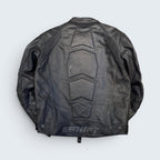 Black leather jacket with protective back padding on a light gray background