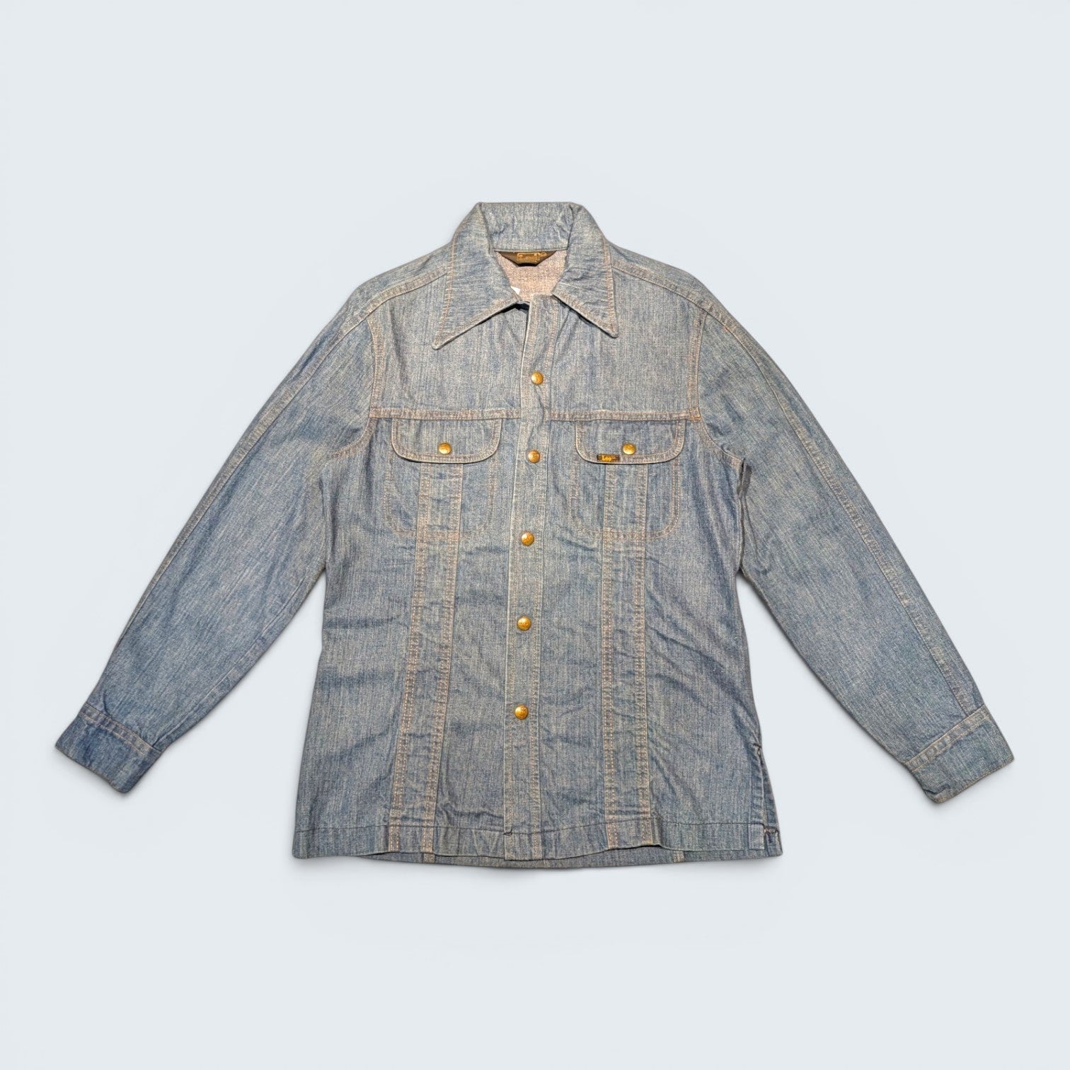 STOXX THRIFT & VINTAGE 1970s Lee long denim jacket in light blue with brass buttons, made in USA.