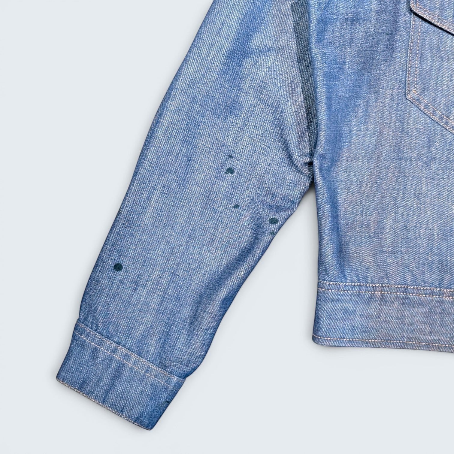 STOXX THRIFT & VINTAGE 1970s Lee Western denim jacket in light blue with unique paint splatter details, made in USA.