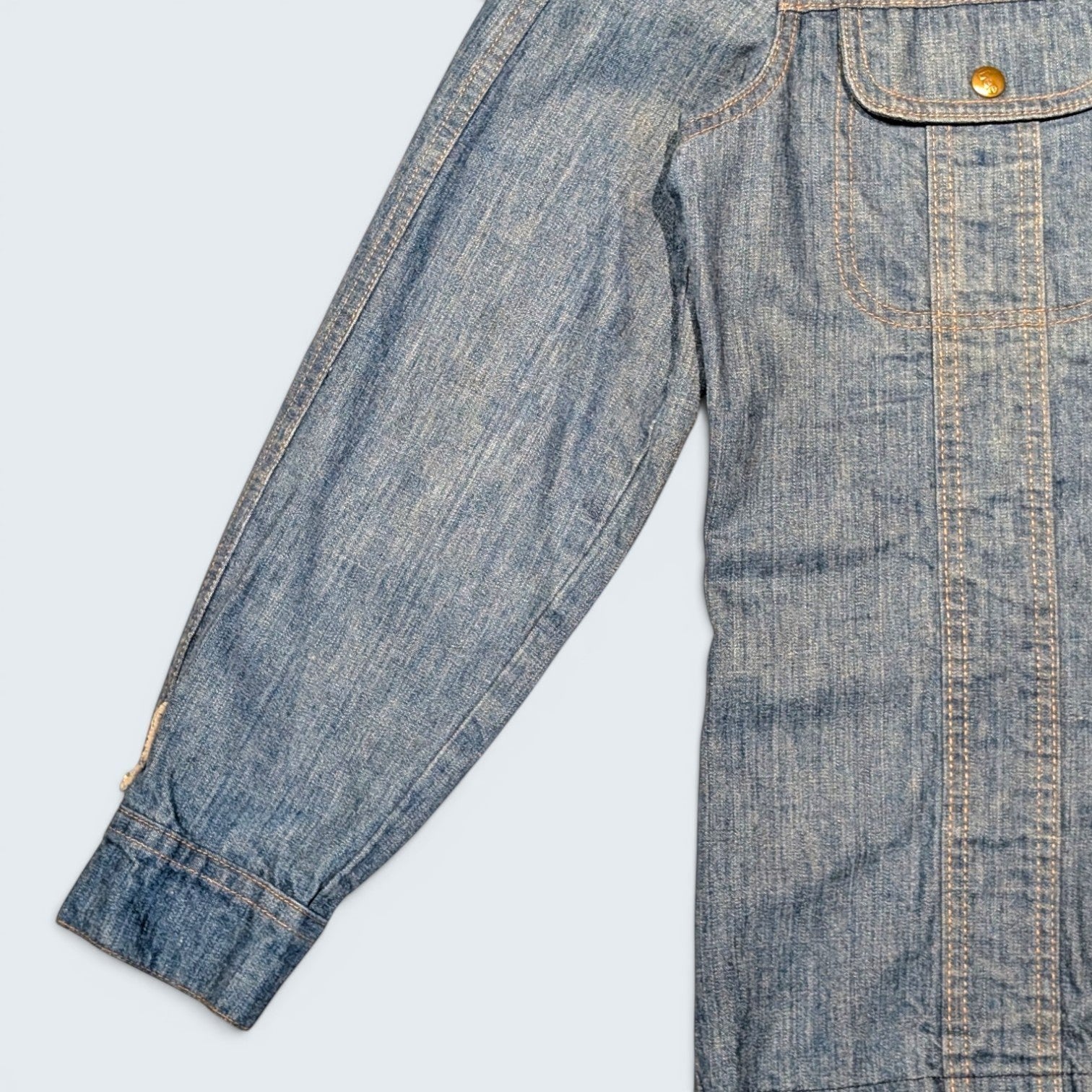 STOXX THRIFT & VINTAGE 1970s Lee long denim jacket made in USA with classic blue wash and contrast stitching.
