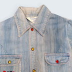 STOXX THRIFT & VINTAGE light wash denim jacket by Fun Wear with colorful snap buttons and butterfly embroidery.