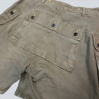 STOXX THRIFT & VINTAGE Buzz Rickson & Co. olive cotton ripstop military cargo shorts with black button details.