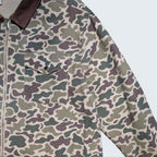 STOXX THRIFT & VINTAGE camo print chore jacket with a brown corduroy collar and front chest pocket.