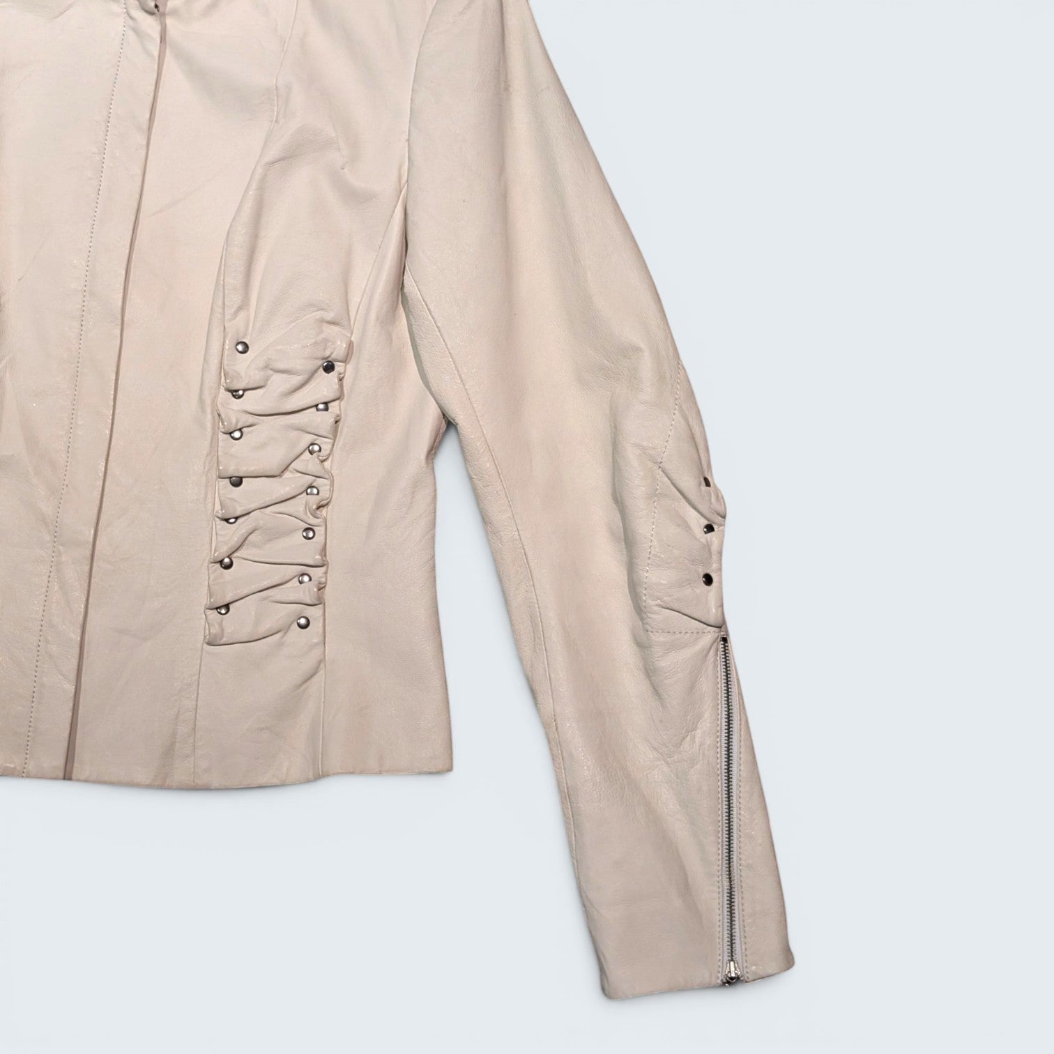 STOXX THRIFT & VINTAGE Danier cream leather jacket with cowl-style ruched side detailing and zippered cuffs.