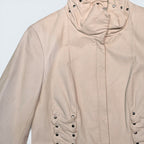 STOXX THRIFT & VINTAGE Danier cream leather jacket featuring a cowl neck and decorative side ruching with metal studs.