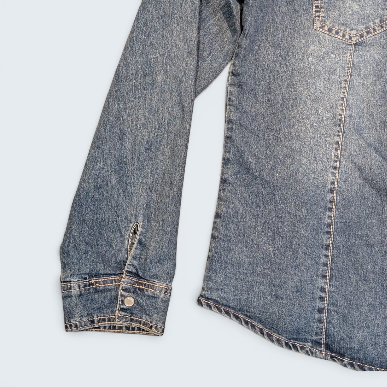 STOXX THRIFT & VINTAGE blue denim shirt with long sleeves, button cuffs, and visible stitching details.
