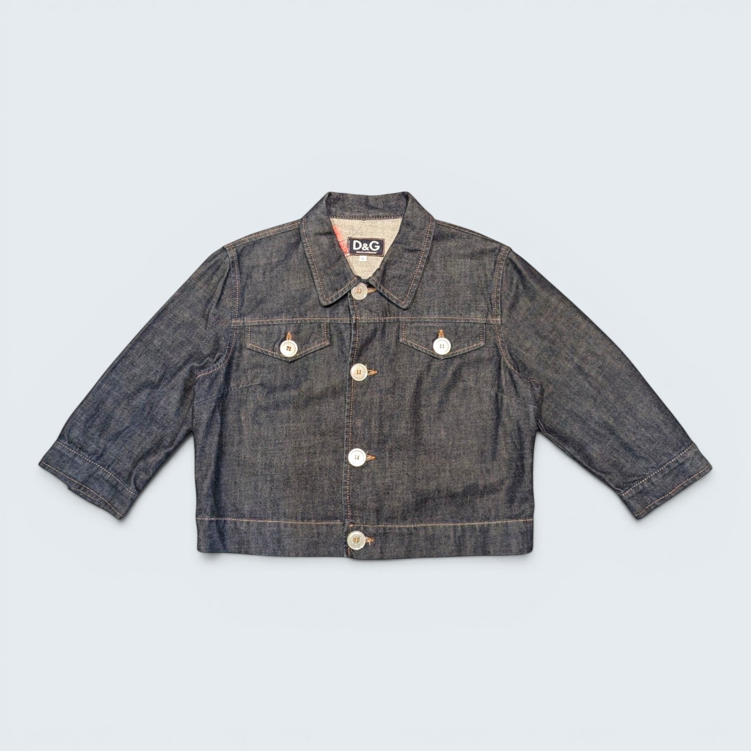 STOXX THRIFT & VINTAGE dark wash Dolce & Gabbana denim jacket with button-up front and chest pockets.
