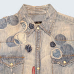 STOXX THRIFT & VINTAGE light wash DSQUARED2 denim shirt with distressed circular patchwork and snap button details.