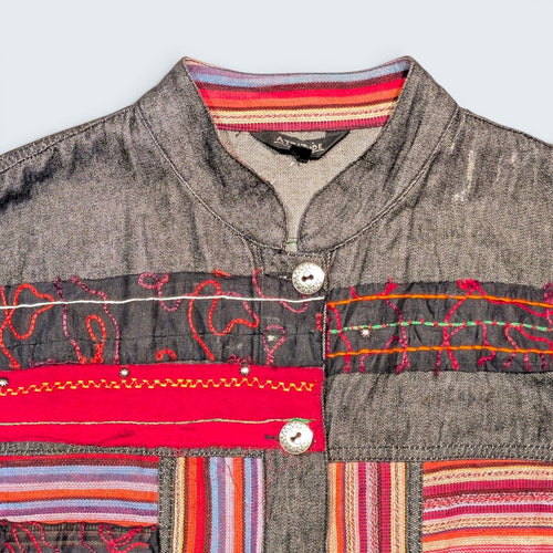 STOXX THRIFT & VINTAGE Attitude denim jacket featuring colorful embroidered patterns, striped trim, and metal buttons.