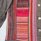 STOXX THRIFT & VINTAGE denim jacket featuring colorful embroidered patchwork panels and metallic button details.