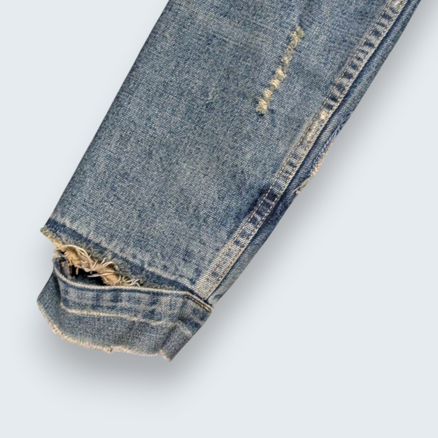STOXX THRIFT & VINTAGE Ezra Fitch blue denim jacket sleeve with distressed detailing and rip on the cuff