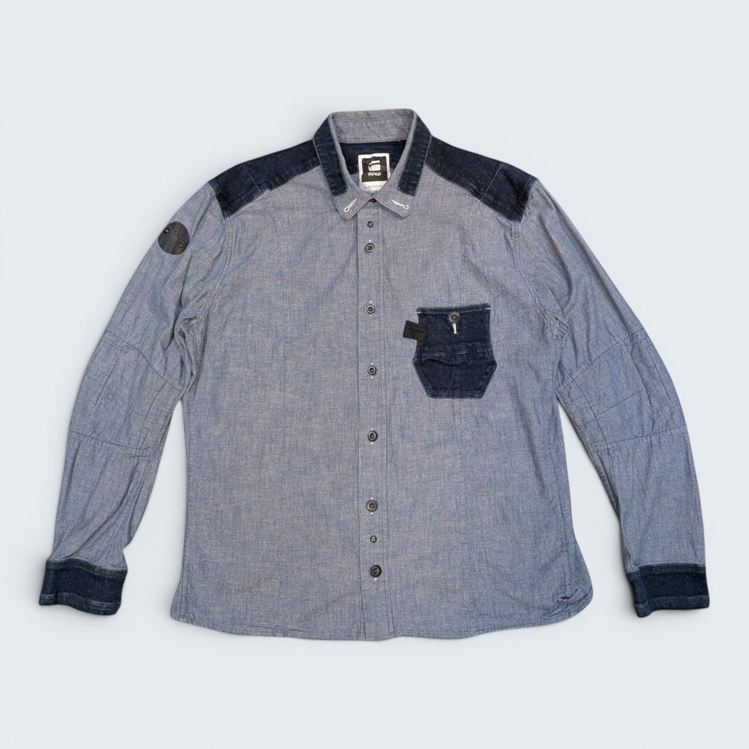 STOXX THRIFT & VINTAGE G-Star Raw denim button-up shirt in light blue with dark contrast panels and chest pocket.