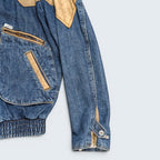 STOXX THRIFT & VINTAGE Guess blue denim jacket with tan leather shoulder yoke, zippered pockets, and elastic hem.