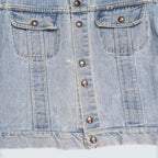 STOXX THRIFT & VINTAGE GWG light wash denim jacket with button-front closure, chest pockets, and vintage detailing.
