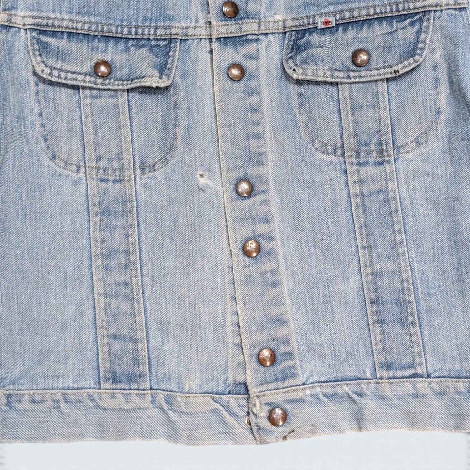 STOXX THRIFT & VINTAGE GWG light wash denim jacket with button-front closure, chest pockets, and vintage detailing.