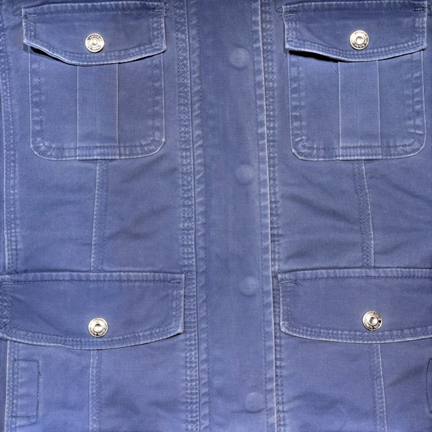 STOXX THRIFT & VINTAGE Kensie blue denim utility jacket with four button-flap pockets and silver hardware.