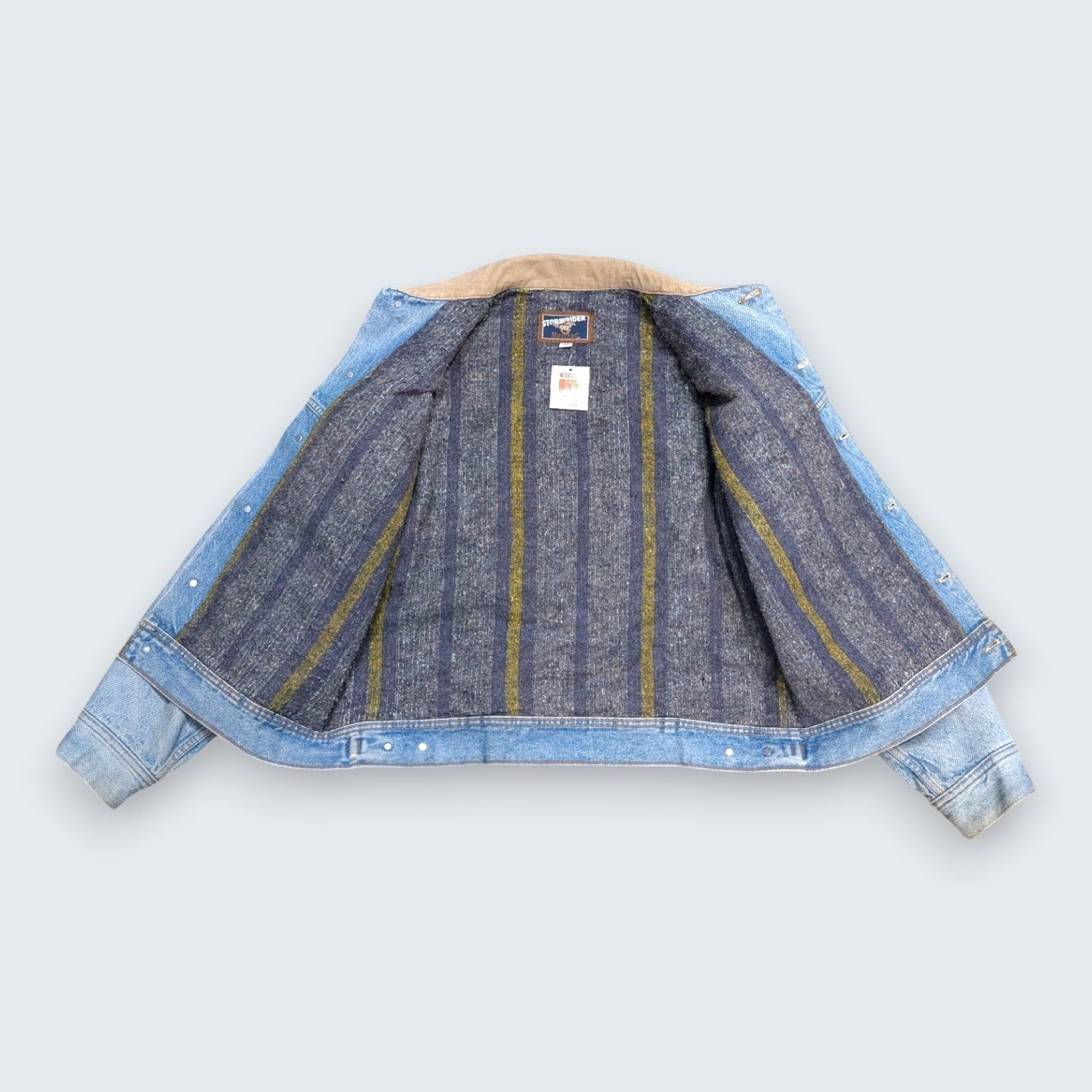 STOXX THRIFT & VINTAGE Levi's Stormrider denim jacket with light-wash cotton, corduroy collar, and striped lining.