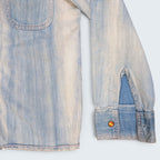 STOXX THRIFT & VINTAGE light wash denim jacket with buttoned cuffs and chest pocket detail.