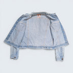 STOXX THRIFT & VINTAGE light wash GWG denim jacket with button-front closure and interior chest pockets.