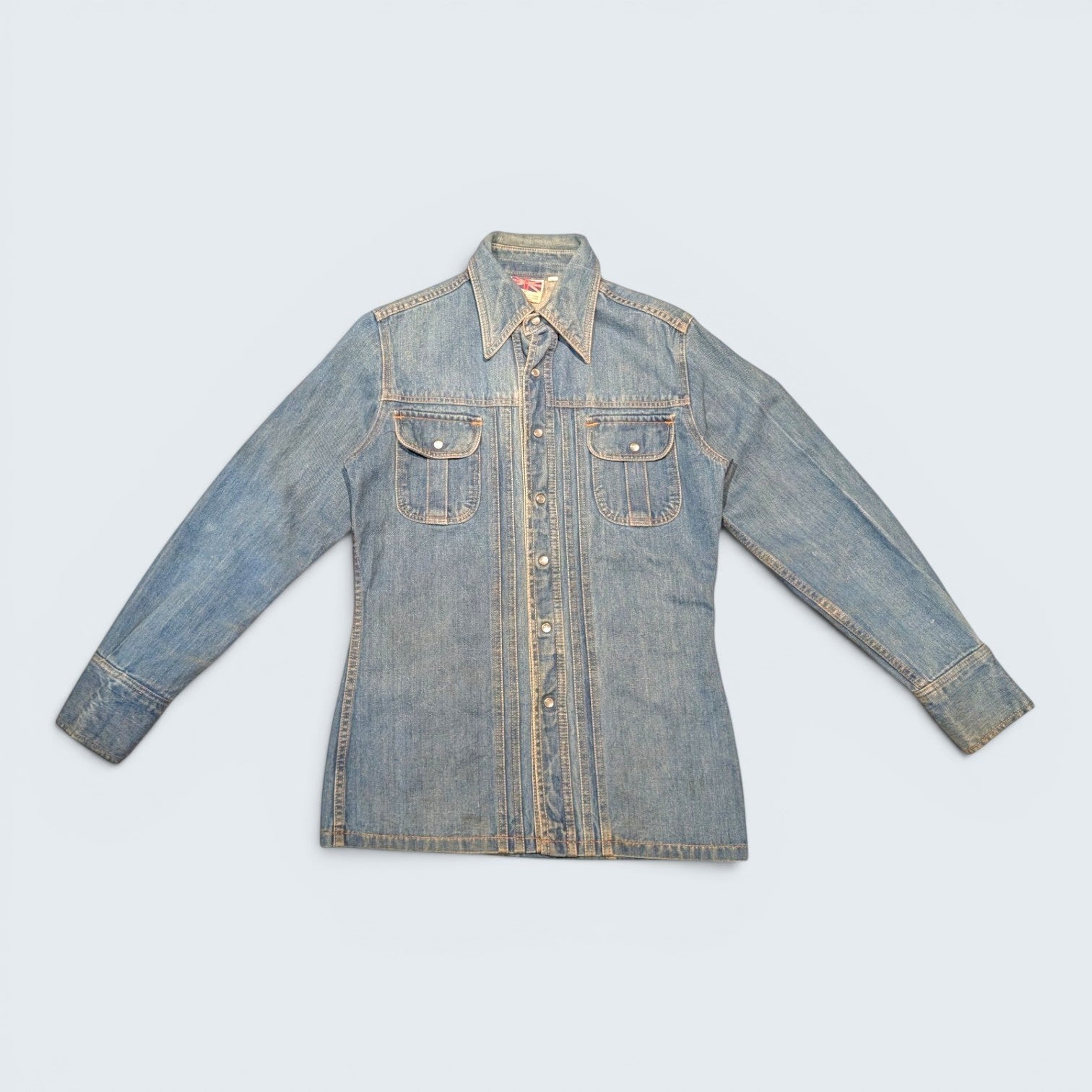 STOXX THRIFT & VINTAGE Britannia Sportswear light-wash denim jacket with snap buttons and two chest pockets.