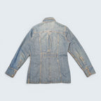 Back view of STOXX THRIFT & VINTAGE Britannia Sportswear light-wash denim jacket with a unique back vent detail.