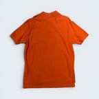 Back view of a STOXX THRIFT & VINTAGE Polo Ralph Lauren burnt orange cotton piqué short-sleeve polo shirt, size XL.