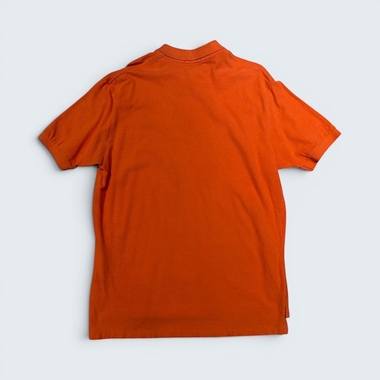 Back view of a STOXX THRIFT & VINTAGE Polo Ralph Lauren burnt orange cotton piqué short-sleeve polo shirt, size XL.