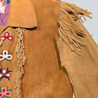 STOXX THRIFT & VINTAGE tan suede jacket with hand-sewn beaded floral patterns and fringe detailing on the shoulders.