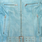 STOXX THRIFT & VINTAGE Vero Moda light blue leather jacket with silver zippers and a buckled waist belt.