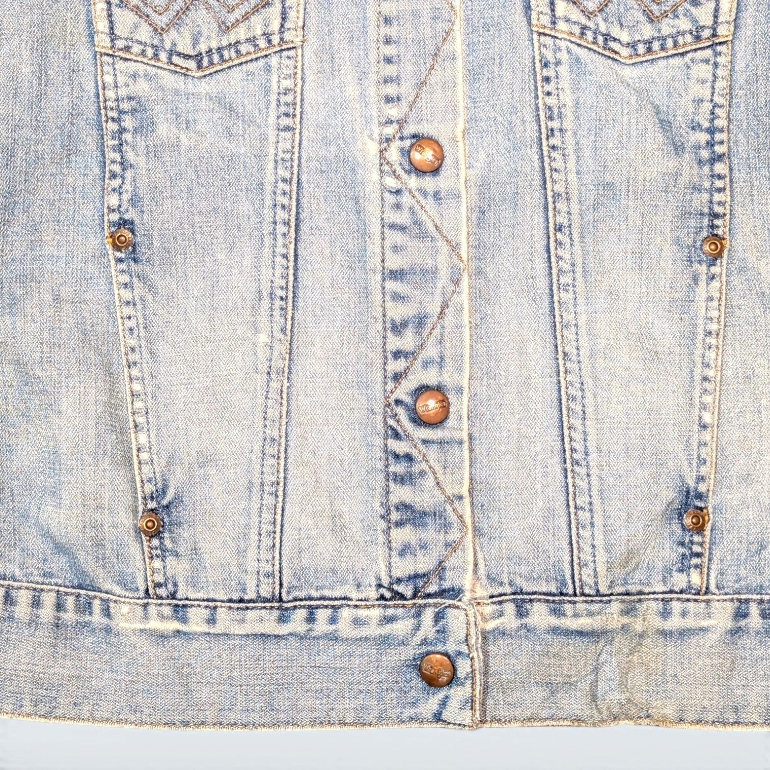 STOXX THRIFT & VINTAGE light wash Wrangler cropped denim jacket with copper buttons and classic stitching details.