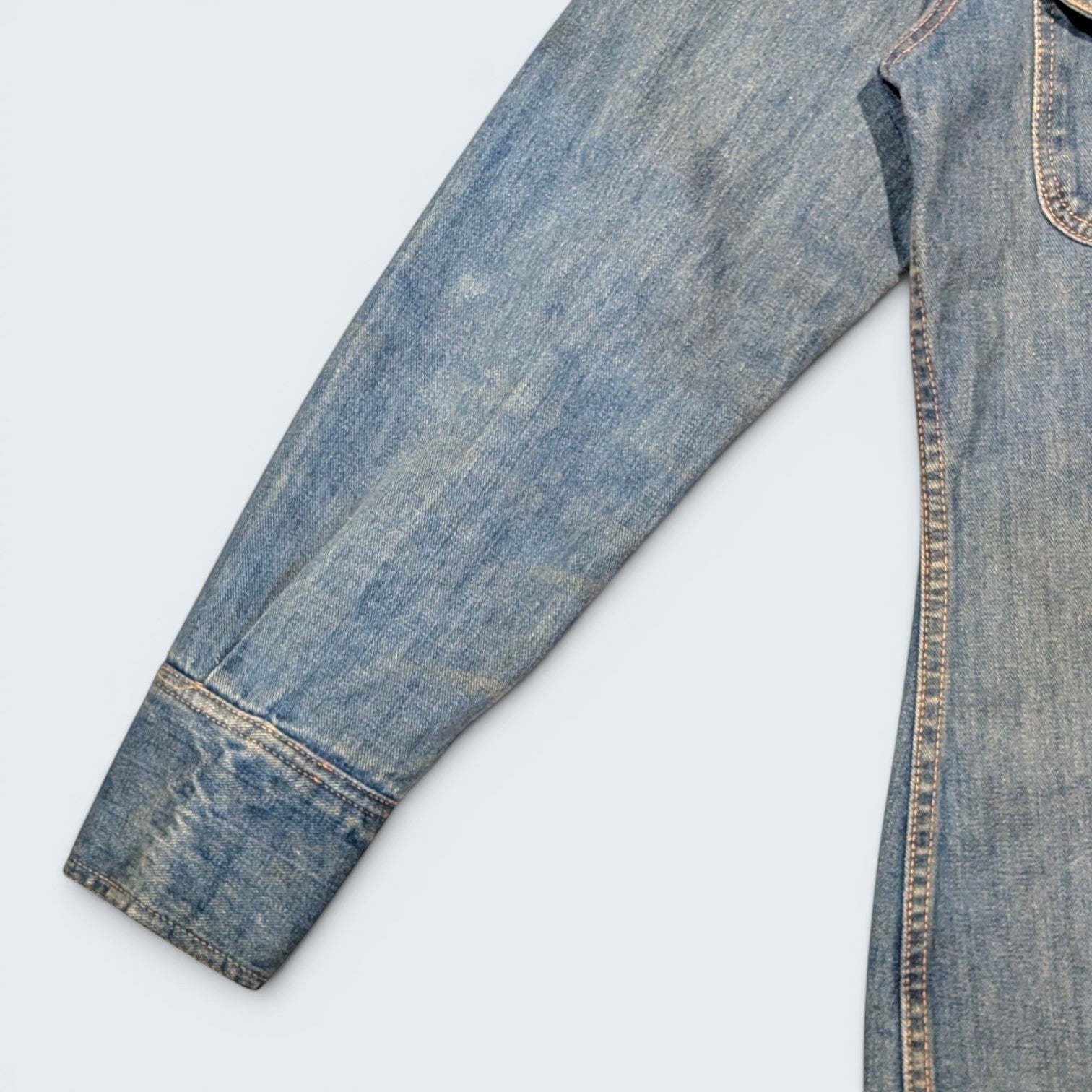 STOXX THRIFT & VINTAGE Britannia Sportswear long denim jacket sleeve in light-wash blue with snap-button cuff.