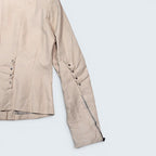 STOXX THRIFT & VINTAGE Danier beige leather jacket with cowl style detailing, metal studs, and zippered cuffs.