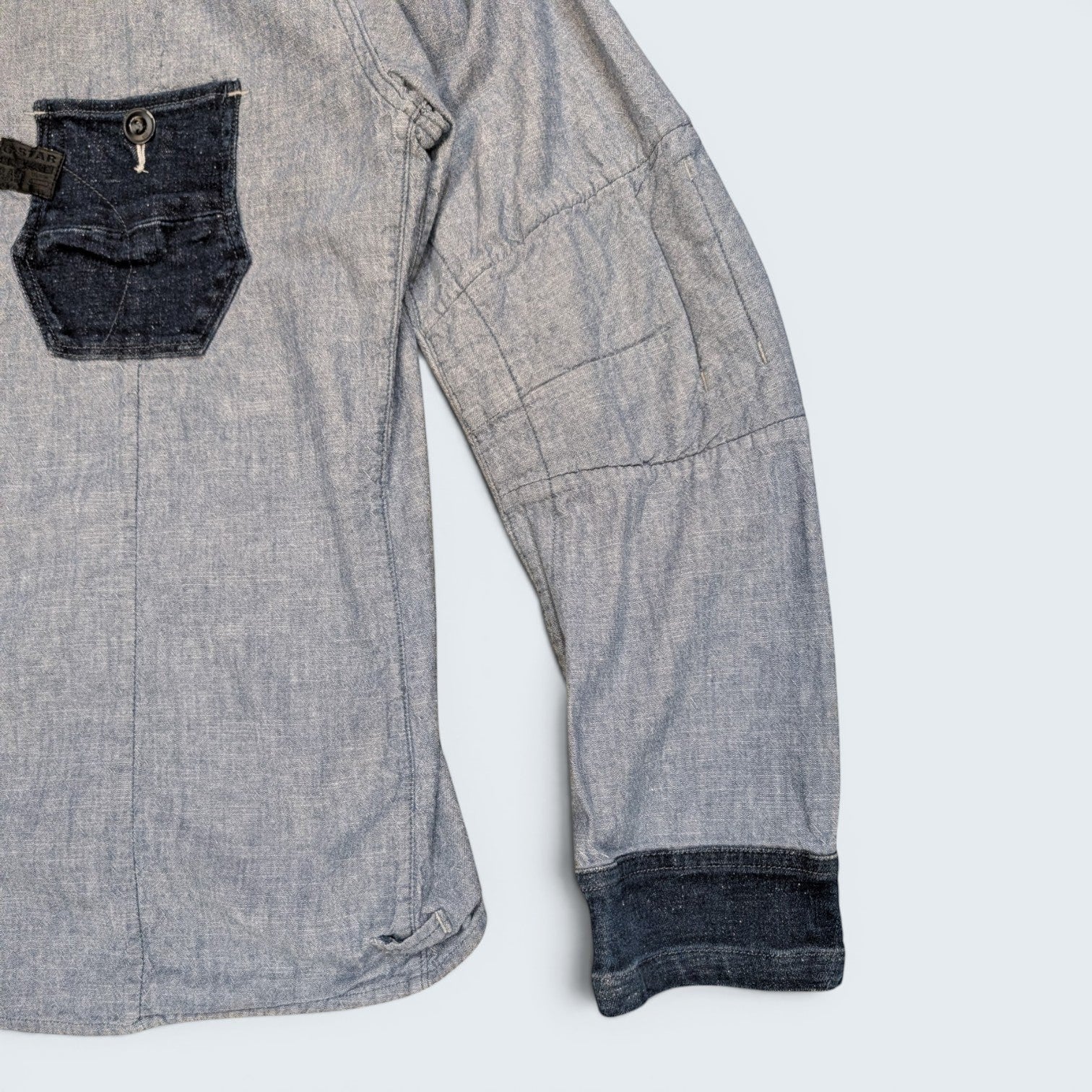 STOXX THRIFT & VINTAGE G-Star Raw light blue denim button-up shirt with dark contrast pocket and cuff detailing.