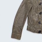 STOXX THRIFT & VINTAGE GAP brown leather double-breasted jacket with button closure and textured finish.