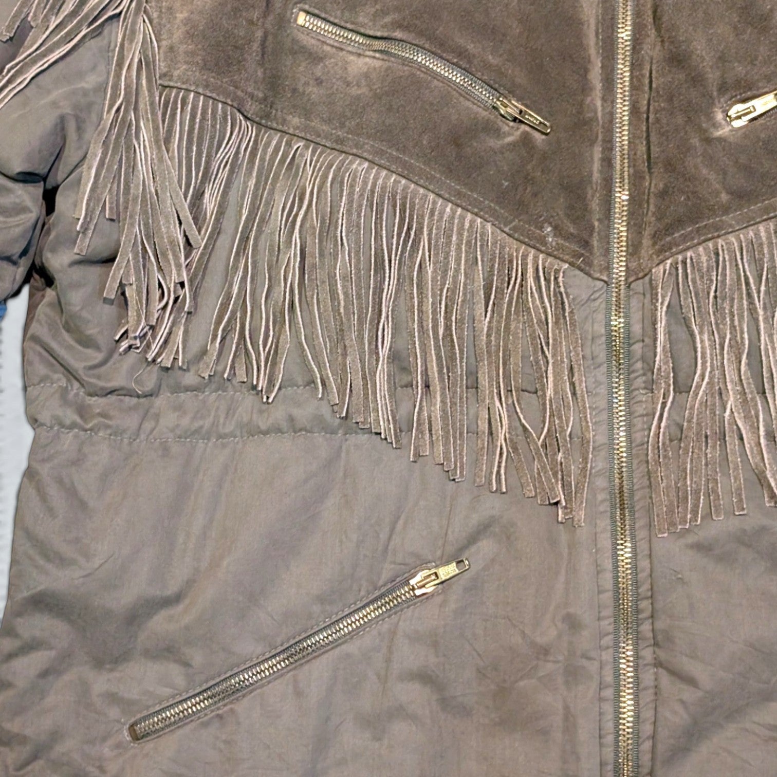 STOXX THRIFT & VINTAGE brown ICEBERG long fringe coat with suede yoke, zip pockets, and metallic hardware.