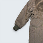 STOXX THRIFT & VINTAGE ICEBERG brown long fringe coat with suede detailing, zippered pockets, and ribbed cuffs.