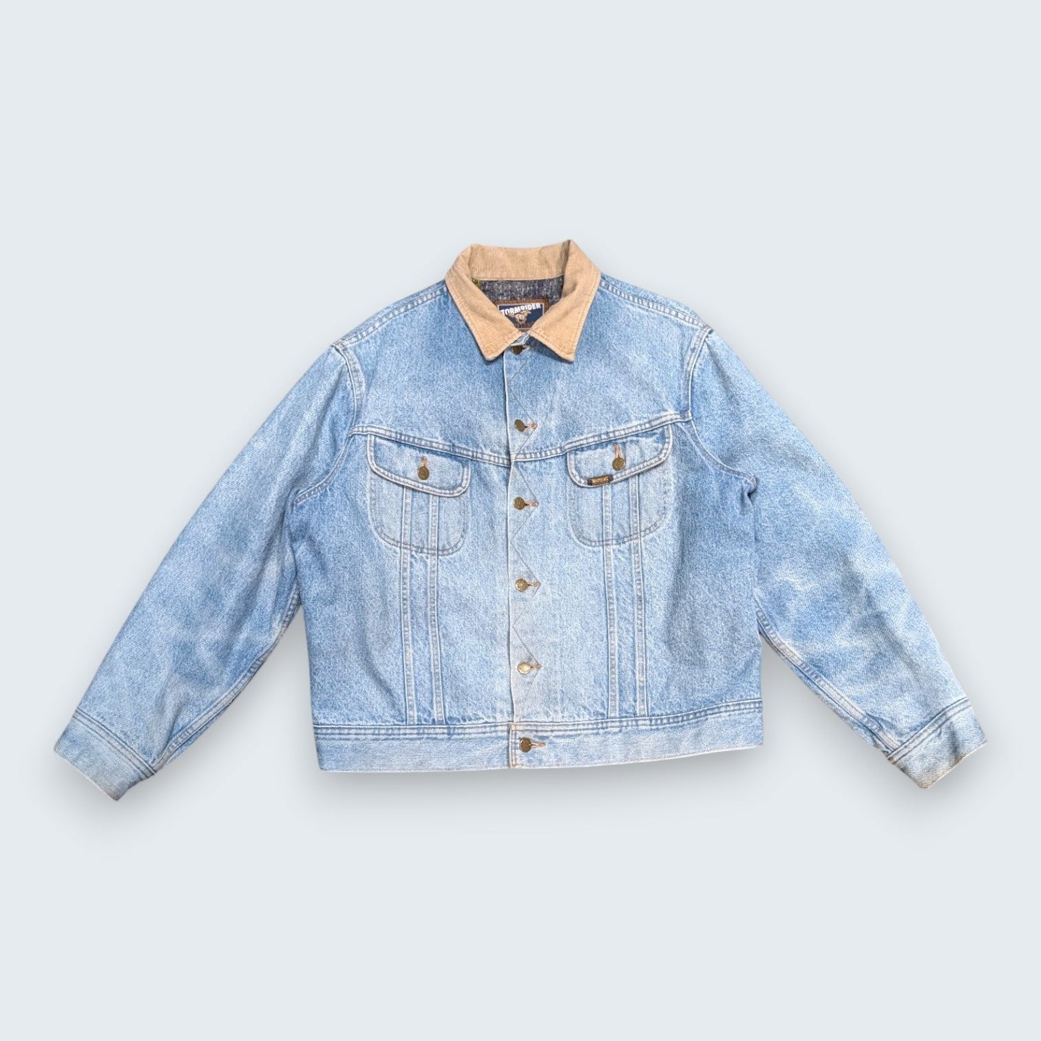 STOXX THRIFT & VINTAGE Levi's Stormrider light-wash denim jacket with tan corduroy collar and striped lining.