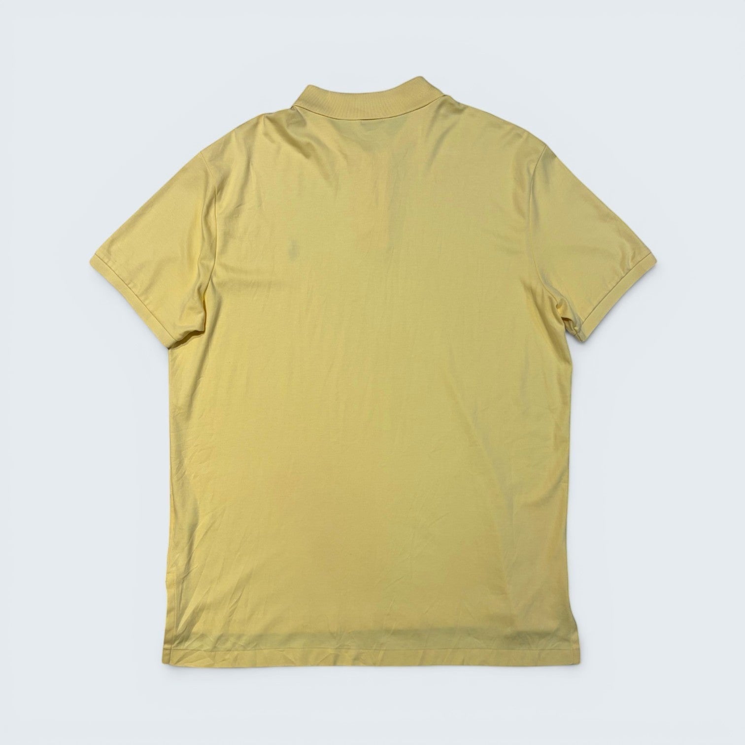 Back view of a pale yellow Polo Ralph Lauren fine knit cotton polo shirt from STOXX THRIFT & VINTAGE, size XL.