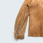 STOXX THRIFT & VINTAGE tan suede jacket with hand-sewn fringe detailing on the sleeve and shoulder.